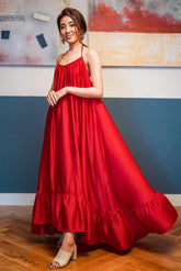 Robe longue dos nu en soie fluide avec col licou réglable et ourlet à volants